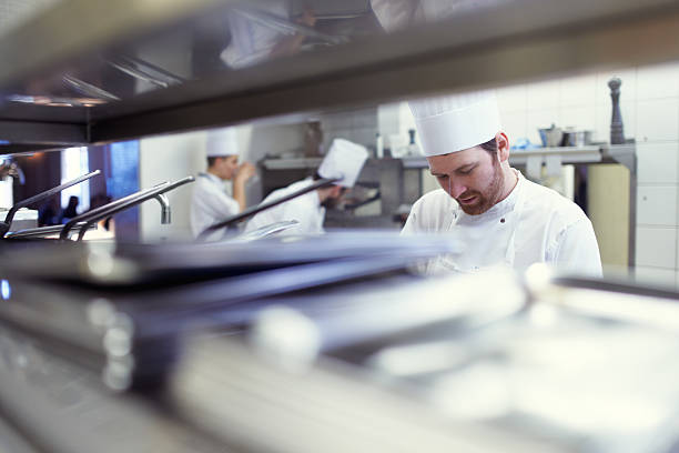 Shot of chefs preparing a meal service in a professional kitchenhttp://195.154.178.81/DATA/i_collage/pu/shoots/804593.jpg
